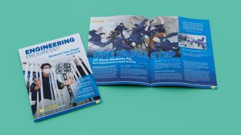 Engineering Progress Magazine laying on a green surface.