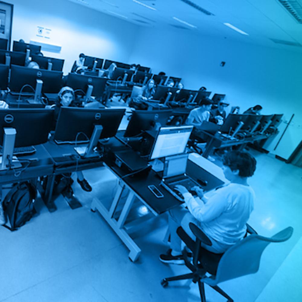 Instructor and students in computer classroom